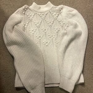 White sweater.